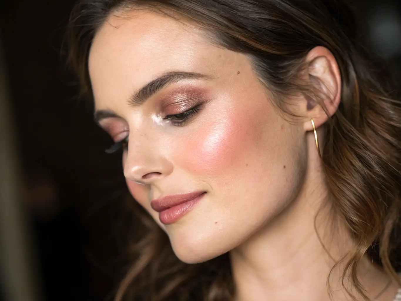 A close-up shot of a woman's face after a skin rejuvenation treatment, showcasing visibly smoother and brighter skin. The lighting is soft and natural, highlighting the improved texture and tone.